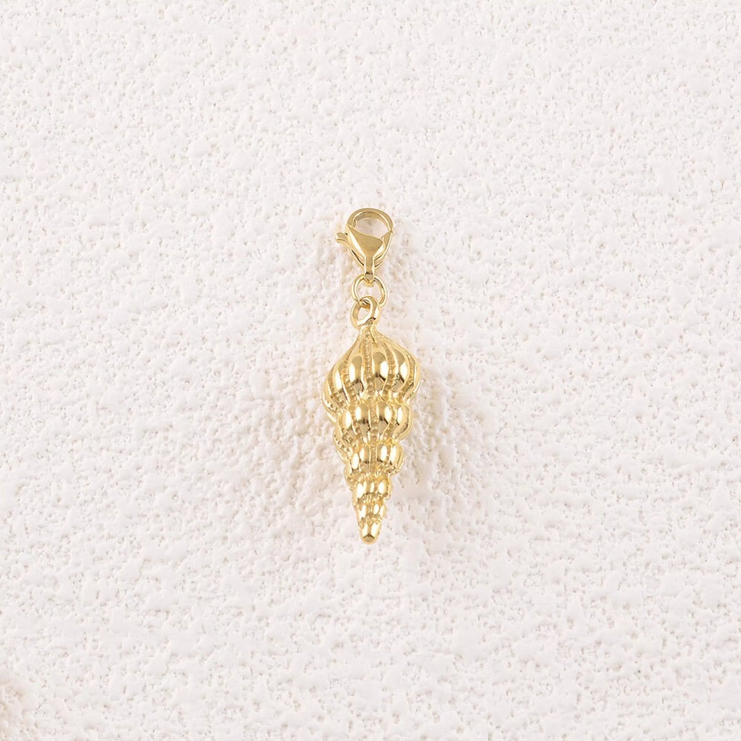 Spiral Shell Charm β Golden glam with seaside soul πβ¨